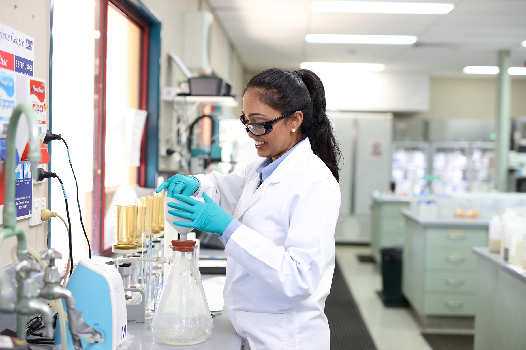 Female lab technician working in Unitywater laboratory