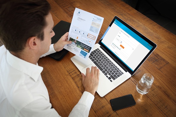 Man paying Unitywater bill on laptop showing credit card payment page