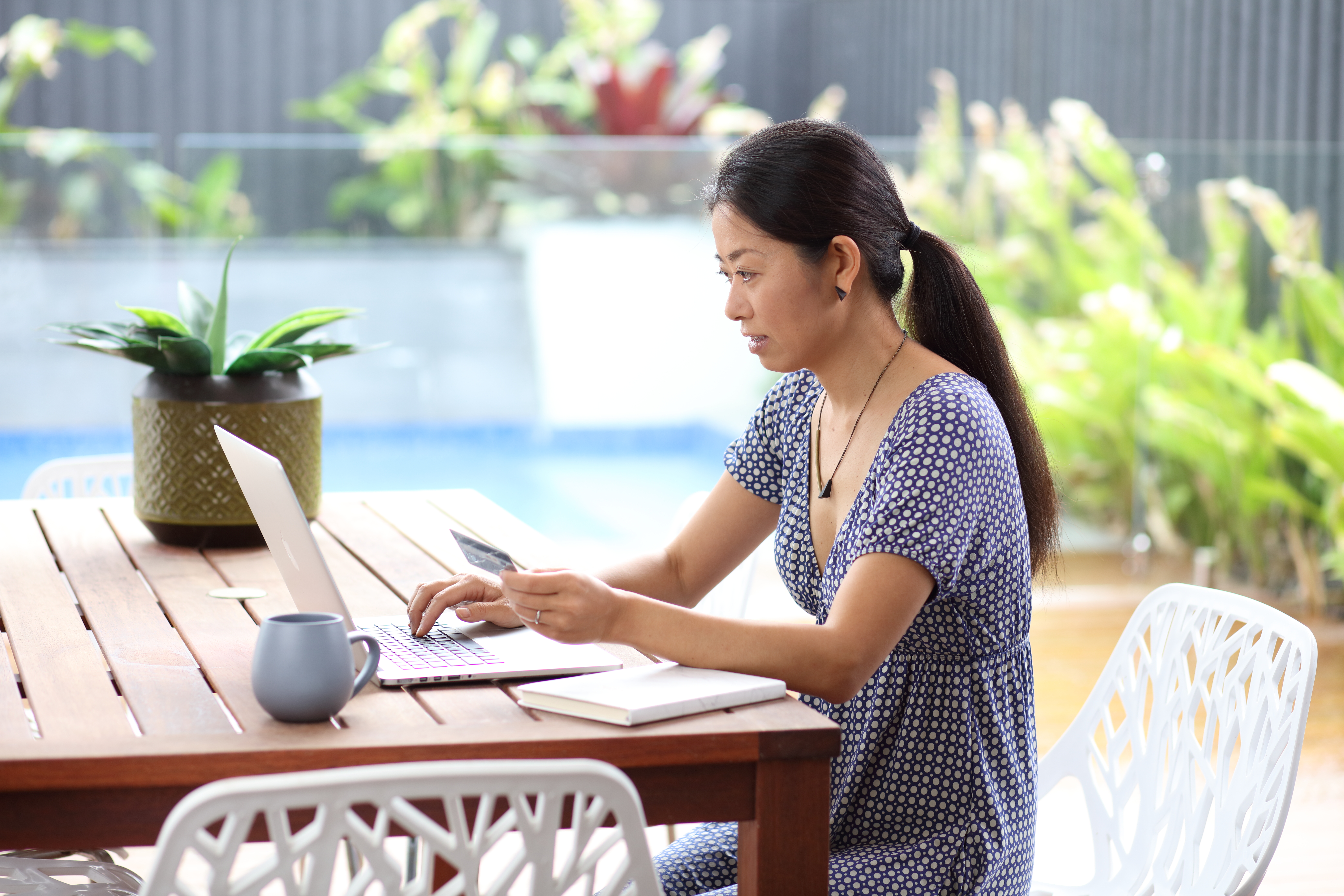 Customer paying bill on laptop