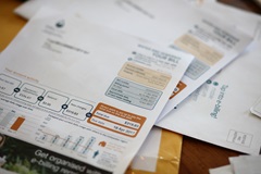 Unitywater bills lying on desk in pile of papers