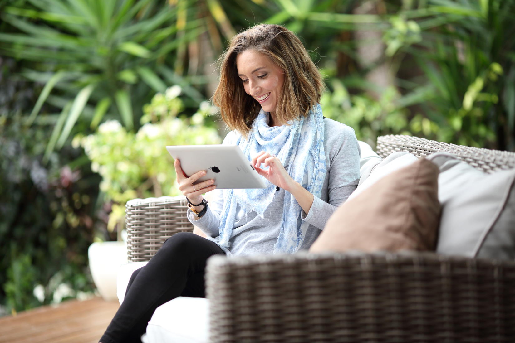 Woman looking at My Account on digital tablet