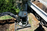 Excavator digging a pool