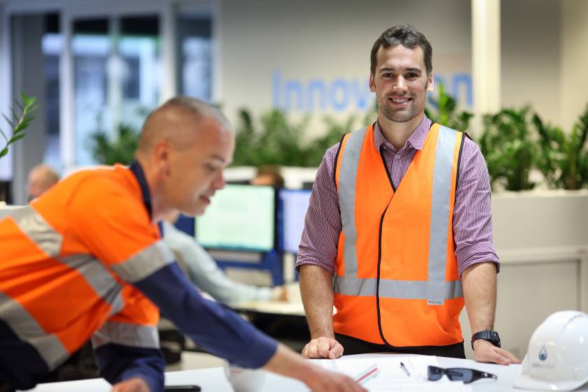 Office staff with plans