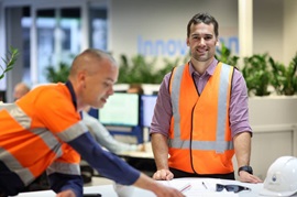 Office staff with plans