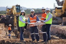 	Certification and accreditation 4 people looking at map on development site