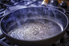 Oil cooking in pan