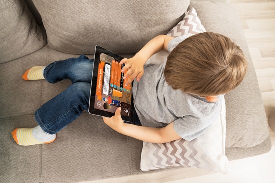 Boy-playing-Sewer-Run-on-digital-tablet