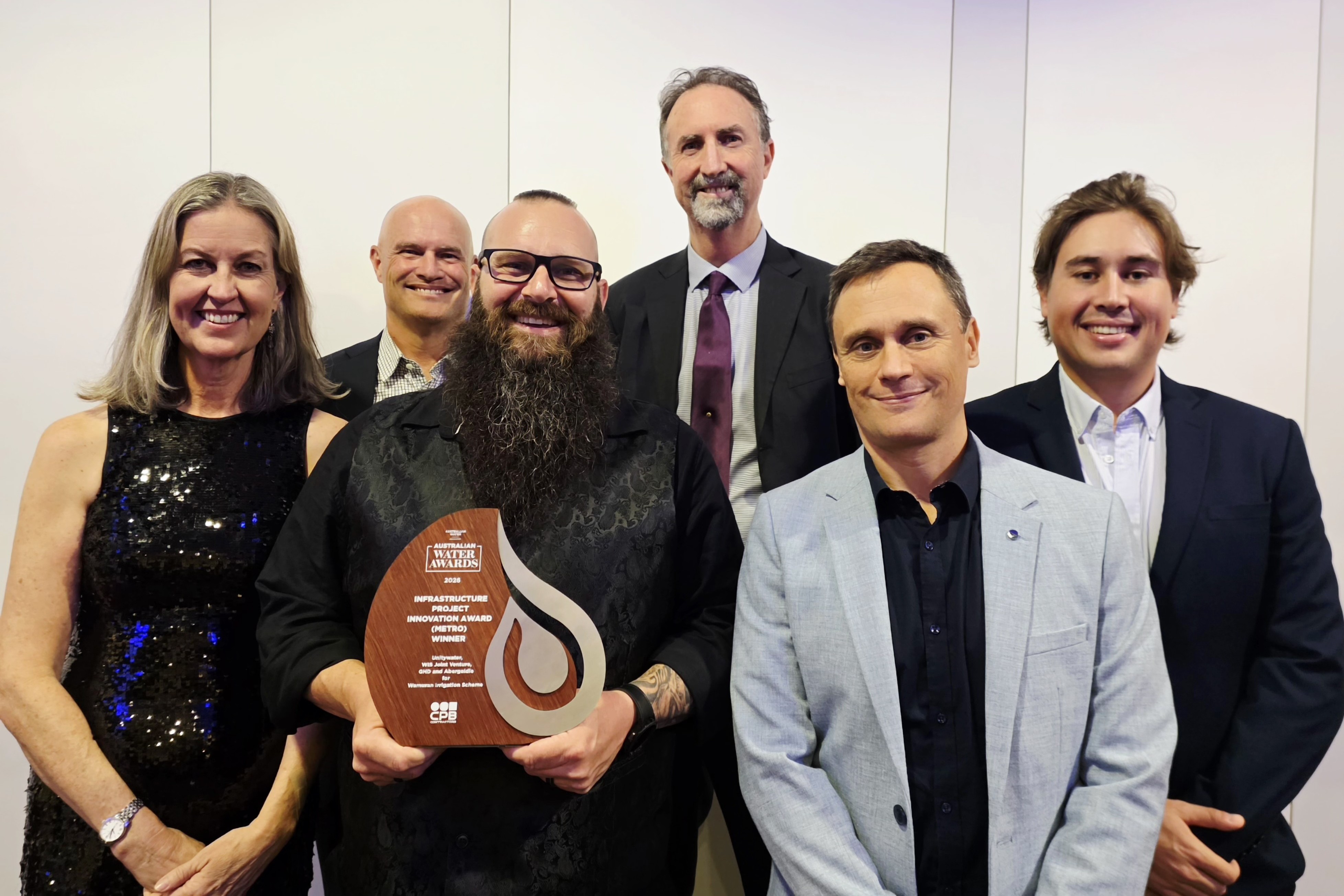 Unitywater team members holding Australian Water Association (AWA) Award for Wamuran Irrigation Scheme