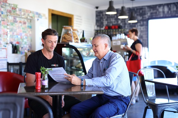 Business owner and Trade Waste Officer discussing Trade Waste Permit