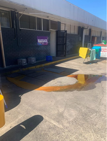 Grease trap arrestor overflow on to car park