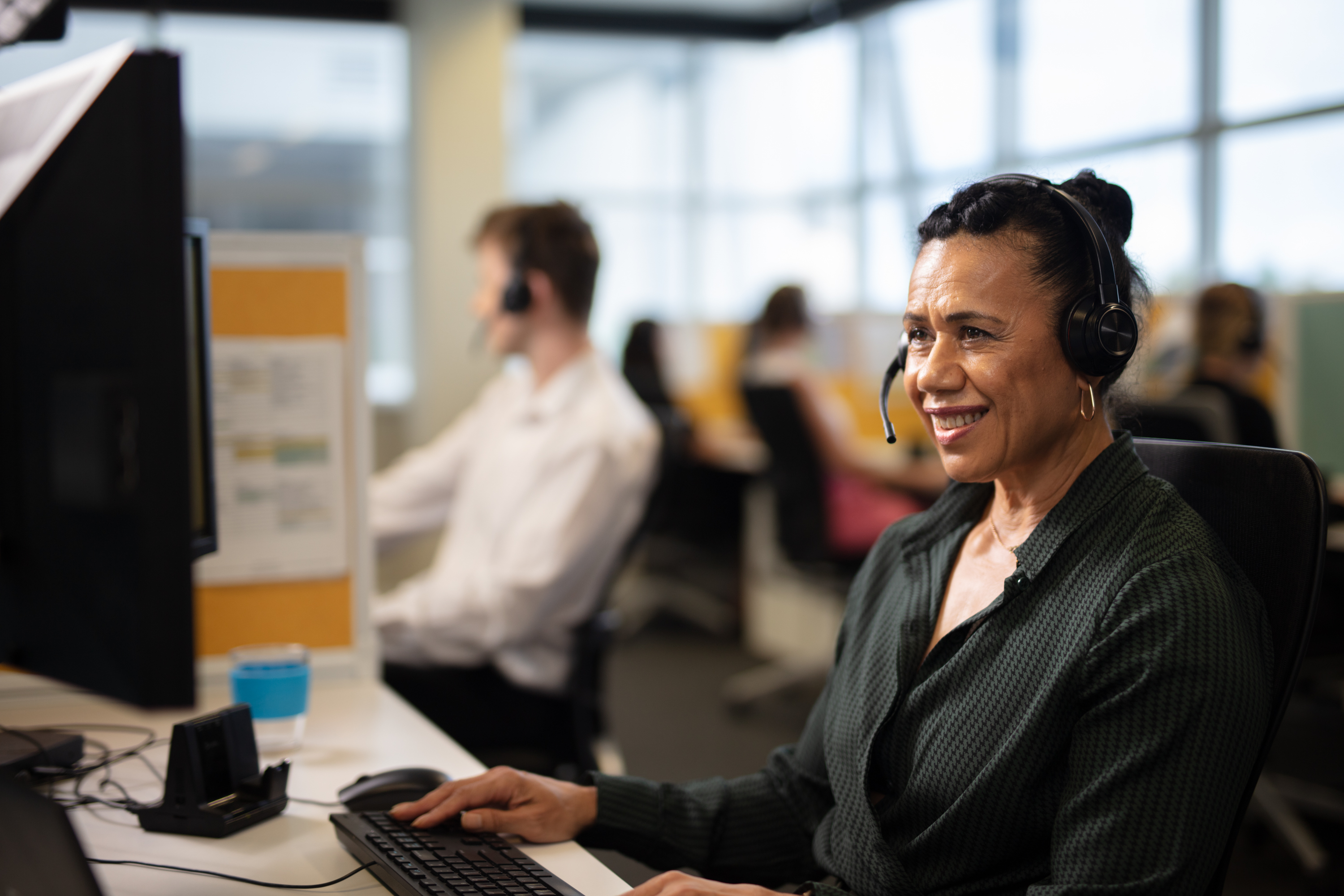 Contact centre team member on call with customer