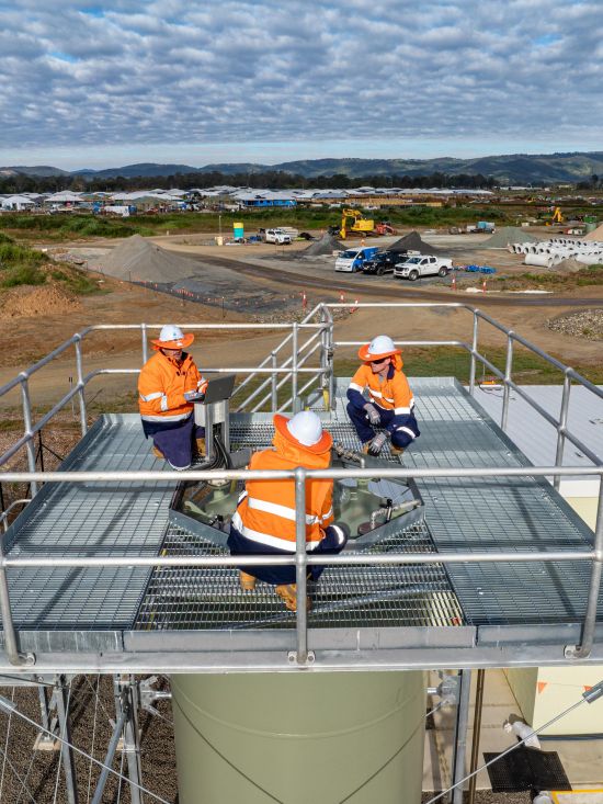 Unitywater field crew working at Waraba Wastewater Pump Station near residential development