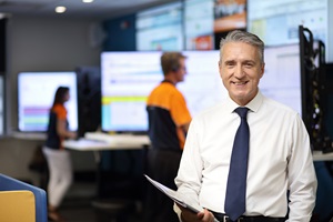 Male staff member holding documents in Unitywater Control Room