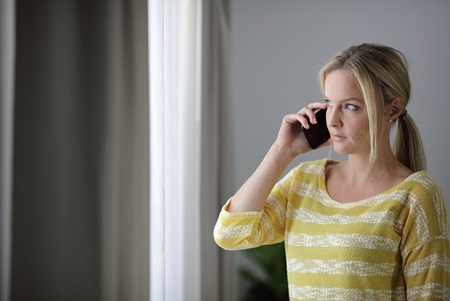 Female customer talking on mobile phone