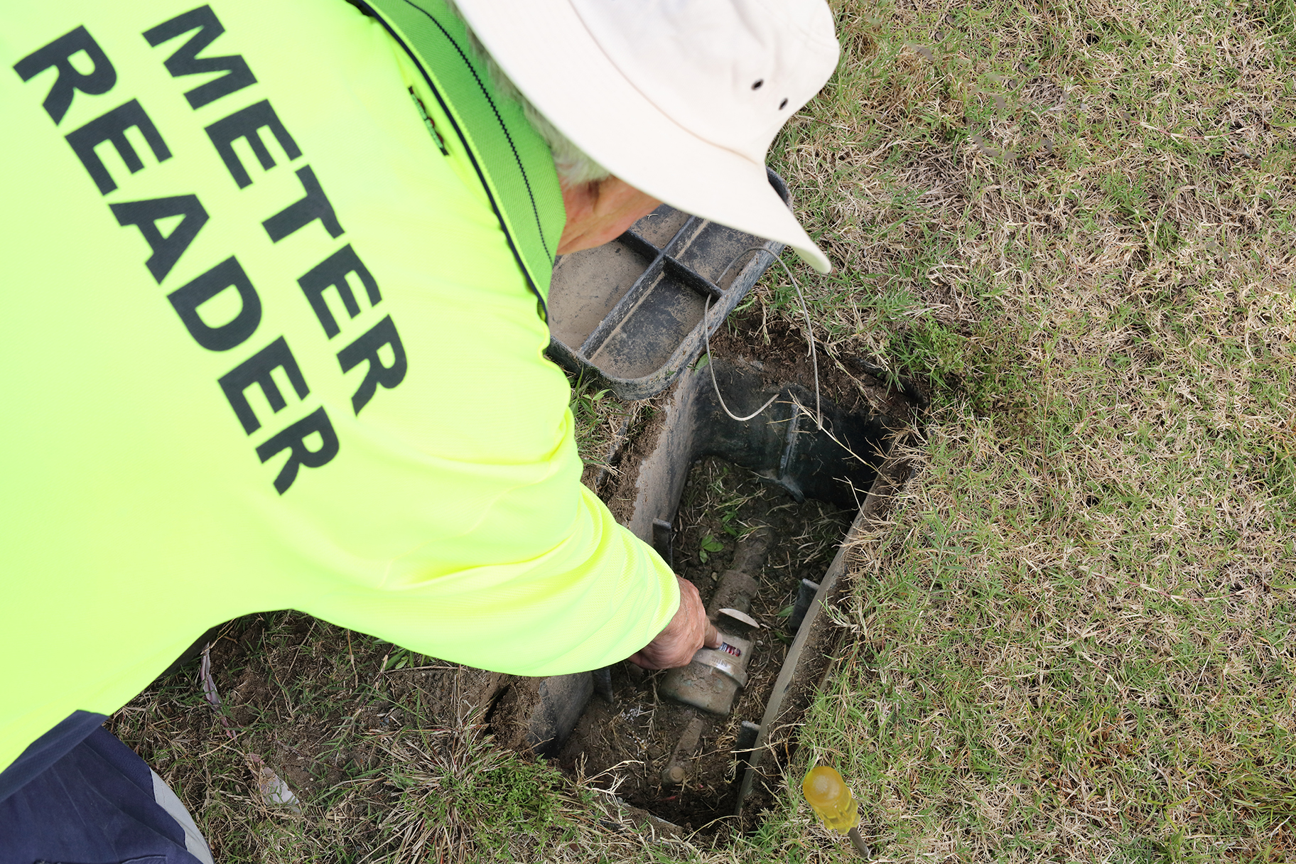 Meter Reading reading water meter at residential property