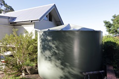 Water tank and house on residential property