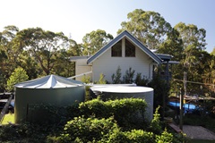 Water tank and house on residential property