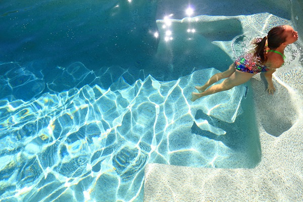 Girl swimming in residential pool